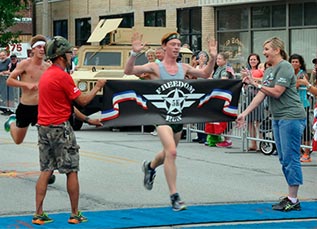photo of a runner crossing the finish line
